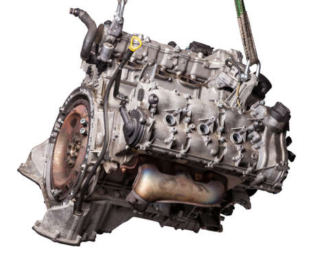 Close Up of V6 engine for the maintenance and repair of a car in a auto service on white isolated...
