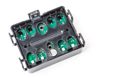 Electronic board in a black plastic box with light and rain sensors to automatically turn on lights...
