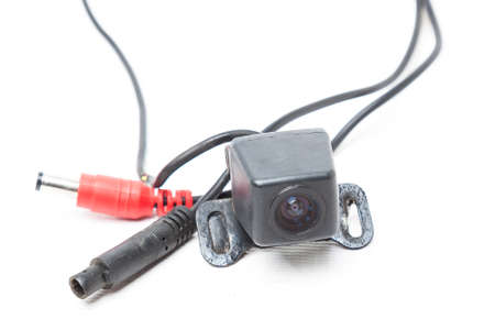 Rear view camera with lens for transferring the image from the back of the car to the monitor while...