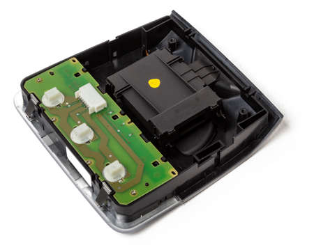Plastic electronic control unit with black and blue connectors on a white isolated background in a...