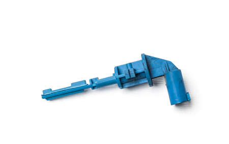 The coolant level sensor is black on a white background with metal elements, it is installed on the...