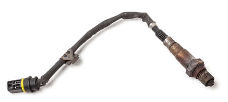 Lambda probe - oxygen sensor device designed to record tamount of remaining oxygen in the exhaust gas of car engine is located in exhaust system. Metal spare part for replacement to repair in workshopの写真素材