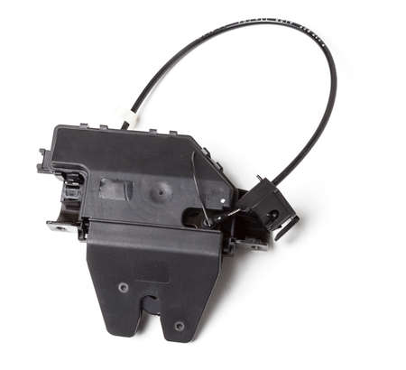 Detail of a car spare part made of black plastic and metal - rear trunk lock separately isolated on...