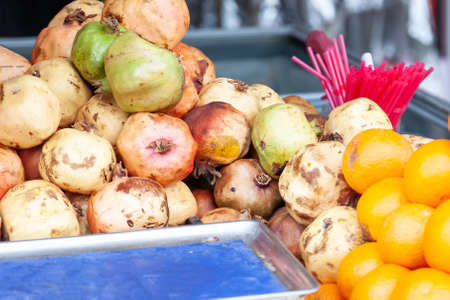 Organic, fresh, red garnet (pomegranate) for sale at a local farmers market in Turkey, close up...