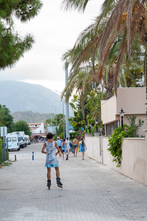 Turkey, Kemer - 09.12.2021: man roller skating on rollers on the streetのeditorial素材