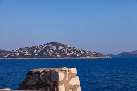 Cukurbag Peninsula with a large number of hotels and houses on a mountainous surface in the Mediterranean Sea in Kas Region, Turkeyの写真素材