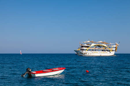 Kemer, Turkey - 08.25.2021: Big cruise ship Mega Star with tourists sailing in the sea in the hot...