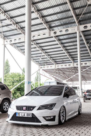 Antalya, Turkey - 08.25.2021: White Seat Leon FR Facelift with tunning lowride at street of Turkey