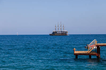Kemer, Turkey - 08.25.2021: Vintage mast wooden sailing ship Medusa for sea tours. Touristic pirate...