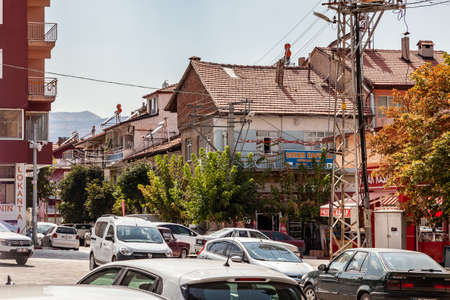 Esilova, Turkey - 08.28.2021: Beautiful summer view of the houses with red tiled roof of the old town and cars in the street in Esilova, Turkey.のeditorial素材