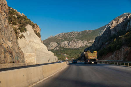 Highway in turkey among mountains and rocks while traveling on a hot summer day. Tourism and rest.の写真素材
