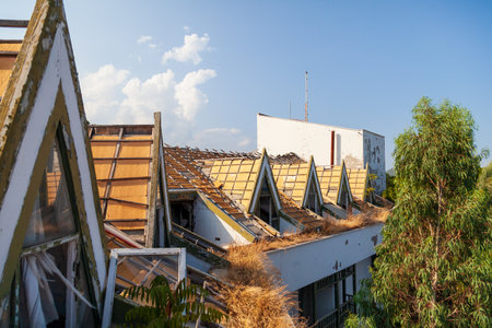 Camyuva, Turkey - 08.30.2021: Abandoned Eco Dream Club Hotel with roof with broken glass and stolen tiles in the Turkish village of kemerのeditorial素材