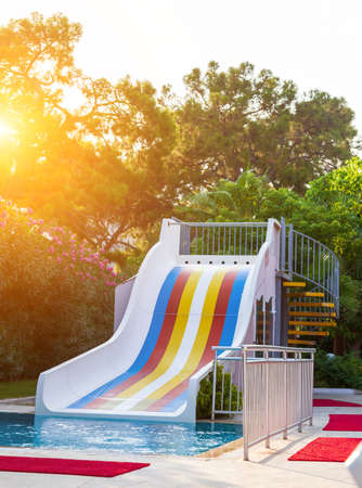 Swimming pool and little slides for children with water in hotel. Getting ready for new touristic season.のeditorial素材
