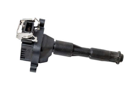 Black ignition coil for engine, isolated on white background. Spare parts for vehicle repair in...