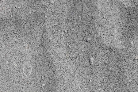 Sand texture. Black and white sand. Background from fine sand. close-up image.