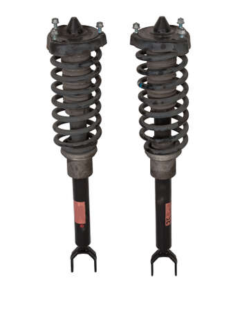 Shock absorber struts with black springs after being used on a car during replacement and repair on a white isolated background. used spare parts. auto parts catalog.の写真素材
