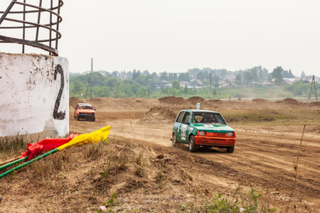 Novosibirsk, Russia - 08.07.2022: Rally off-road car make a turn with the clouds and splashes of...