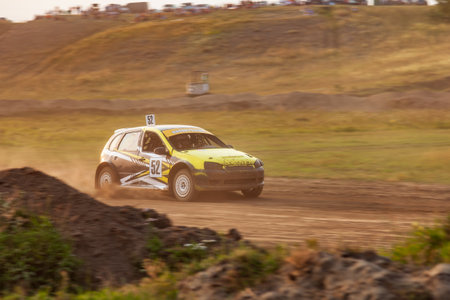Novosibirsk, Russia - 08.07.2022: Rally off-road car make a turn with the clouds and splashes of sand, gravel and dust during rally championshipのeditorial素材