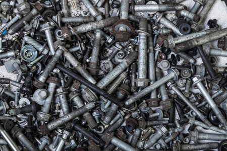Background of bolts and nuts of different lengths and threads. industry and production.の写真素材