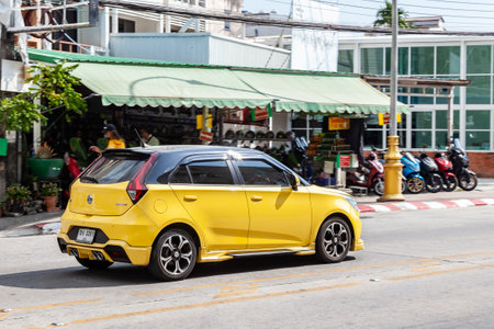 Thailand, Phuket - 03.31.23: Yellow car model Morris Garage MG3 hatchback body on the street.