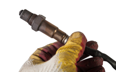 Lambda probe - oxygen sensor device designed to record the amount of remaining oxygen in the exhaust gas of car engine is located in exhaust system. Metal spare part for replacement to repair in workshop.の写真素材