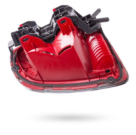 A pair of headlights of a stop signal for a German auto - optical equipment of white and red color on a white isolated background. A spare part for repair and sale in a car service center.の写真素材