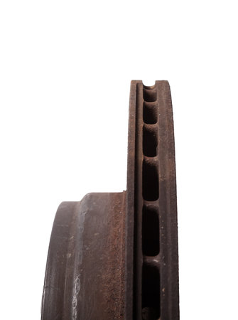 Old brake discs covered with rust on a white isolated background in a photography studio. Seasonal repair of suspension and brake system in workshop or sale of spare parts for auto analysis.の写真素材