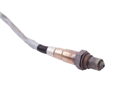 Lambda probe - oxygen sensor device designed to record tamount of remaining oxygen in the exhaust gas of car engine is located in exhaust system. Metal spare part for replacement to repair in workshopの写真素材