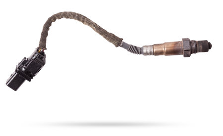 Lambda probe - oxygen sensor device designed to record tamount of remaining oxygen in the exhaust gas of car engine is located in exhaust system. Metal spare part for replacement to repair in workshopの写真素材