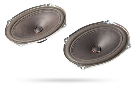 speakers of an acoustic system - an audio for playing music in a car interior on a white isolated background in a photo studio. Spare parts for auto repair in a workshop or for sale for tuningの写真素材