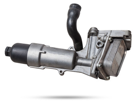 Engine oil filter housing with cooler on a white background. Spare parts catalogの写真素材