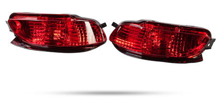 A taillight of a stop signal for a German auto - optical equipment of white and red color on a white isolated background. A spare part for repair and sale in a car service center.の写真素材