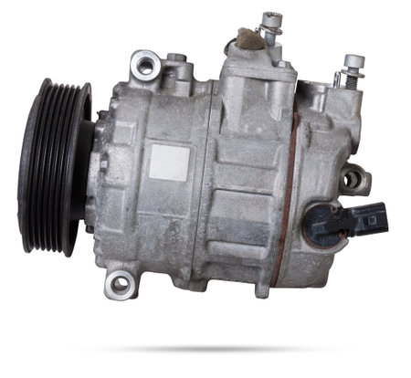 Car spare part air conditioning compressor - pump for supplying freon under pressure to the climate control system to cool the air in hot summer. Spare parts catalog from junkyard.の写真素材