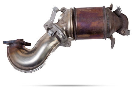 Automotive catalyst removed from a vehicle for repair with a ceramic coating inside as part of an exhaust system to remove harmful emissions in a car repair shopの写真素材