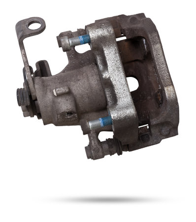 Old metal brake caliper on a white background for replacement during the repair of the chassis or for a catalog of spare parts for sale on auto parsing.の写真素材