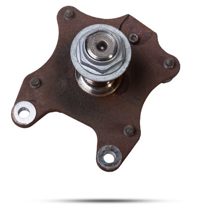 A close-up of a worn metal wheel hub with oil and rust elements on a white background. Seasonal undercarriage repair and replacement of brake system parts in a workshop.の写真素材