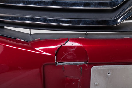 Car bumper broken with a crack after an accident for repair and insurance.の写真素材