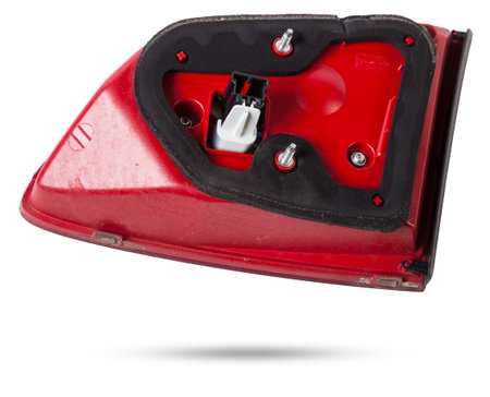 A taillight of a stop signal for a German auto - optical equipment of white and red color on a white isolated background. A spare part for repair and sale in a car service center.の写真素材