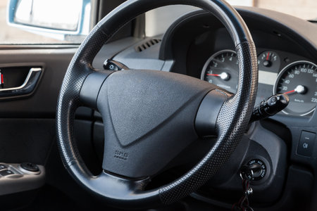 Spare part and interior element of a car steering wheel with leather trim and buttons with airbag on...
