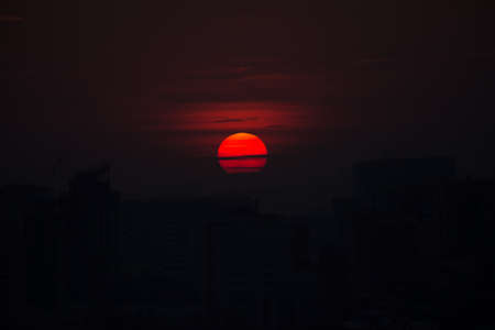 Red sunset over the city at summerの写真素材