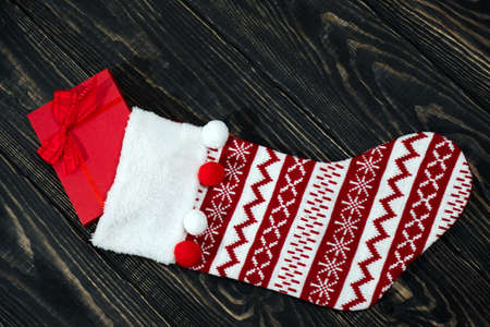 Christmas decoration stocking and toys hanging over rustic wooden background. New Yearの写真素材