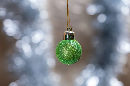Green christmas glass ball on the background. New Year.の写真素材