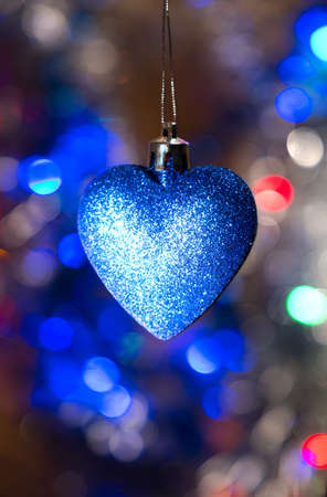 Christmas deep blue heart on the color background. New Year. Round Lights.の写真素材