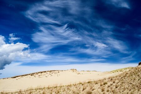Spectacular cloudy sky over sandy ground in the middle of Europeの写真素材