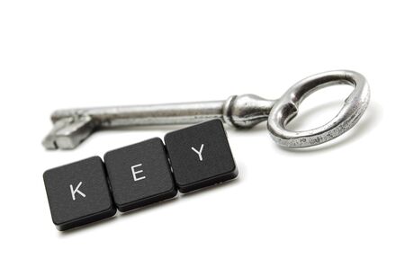 old shiny key and a button with the keywordの写真素材