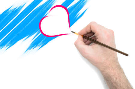 arm and hand on a light background, drawing festive greetingsの写真素材
