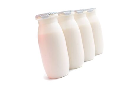 Plastic packaging for sour-milk products on a white backgroundの写真素材