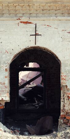 Entrance to an abandoned old building in the form of an archの写真素材