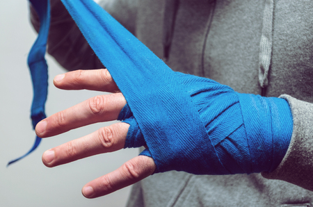 An athlete's fist, a boxer bandaged with an elastic bandageの写真素材