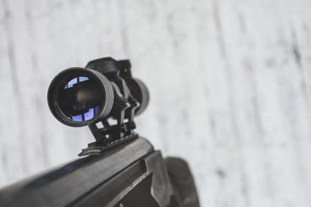 air rifle with an optical sight on a light backgroundの写真素材